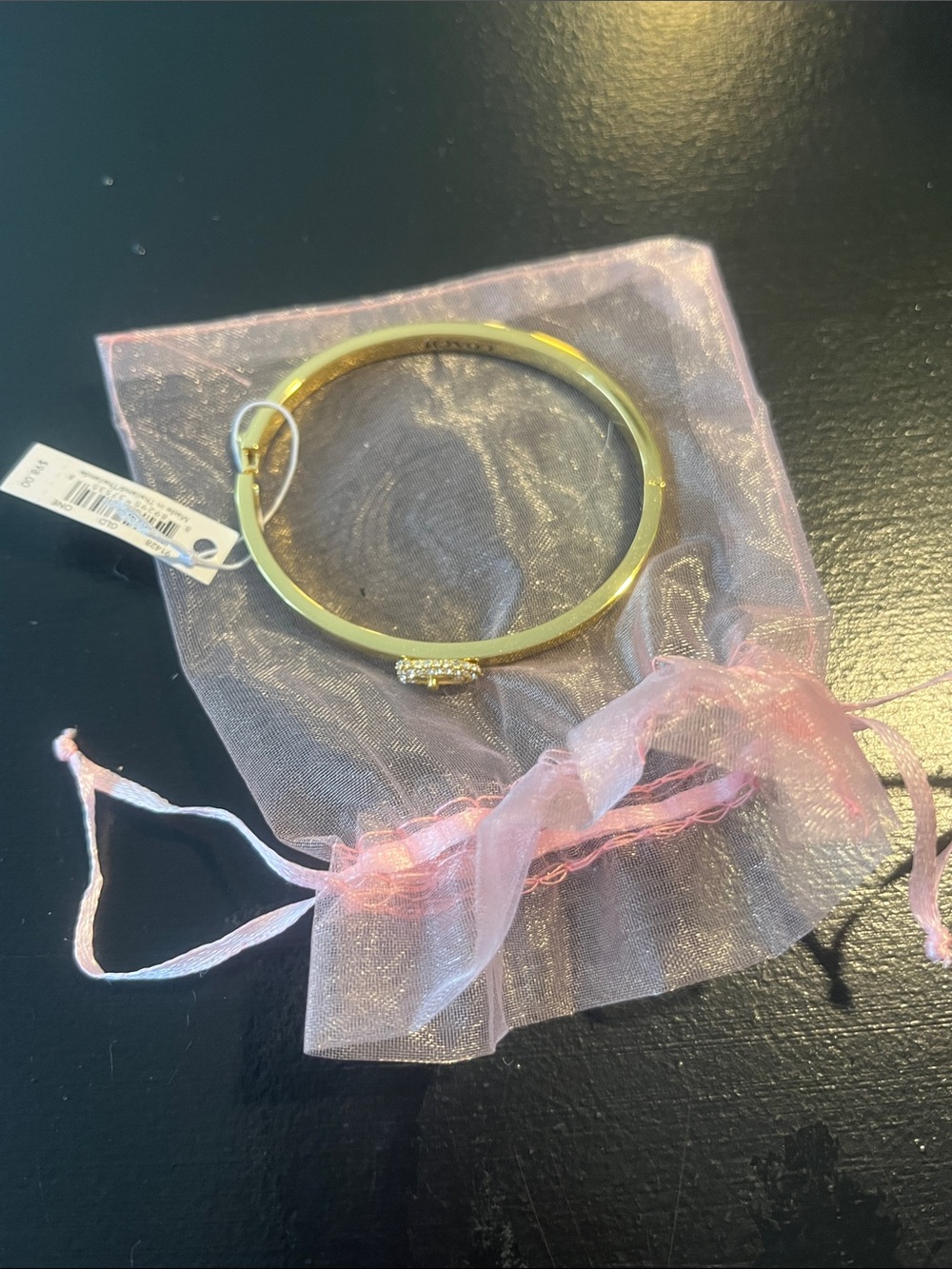 Coach Gold Tone Oval Crystal Accent Bangle Bracelet